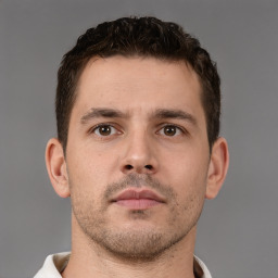 Neutral white young-adult male with short  brown hair and brown eyes