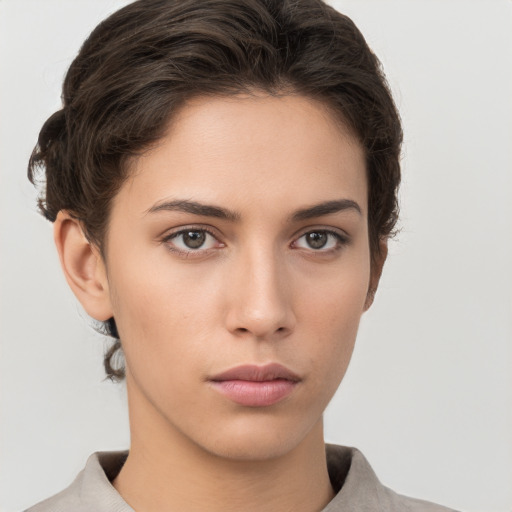 Neutral white young-adult female with short  brown hair and brown eyes