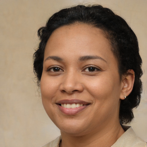 Joyful latino young-adult female with medium  brown hair and brown eyes