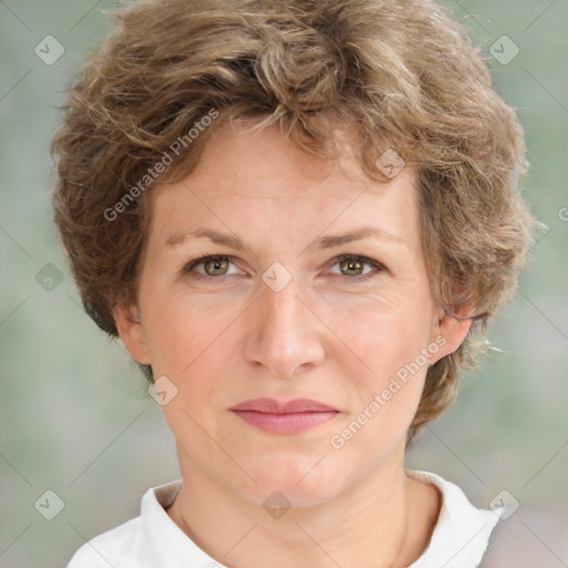 Joyful white adult female with medium  brown hair and green eyes