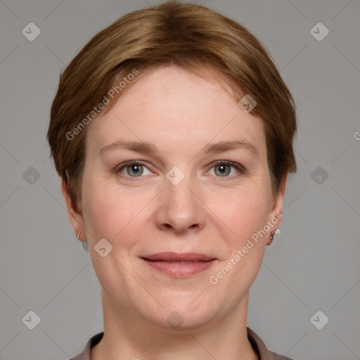 Joyful white adult female with short  brown hair and grey eyes