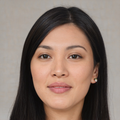 Joyful asian young-adult female with long  black hair and brown eyes