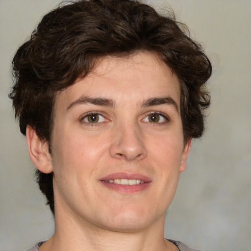 Joyful white young-adult male with medium  brown hair and brown eyes