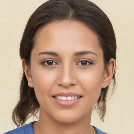 Joyful white young-adult female with medium  brown hair and brown eyes