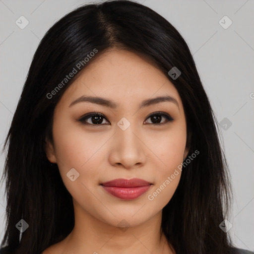 Joyful latino young-adult female with long  black hair and brown eyes