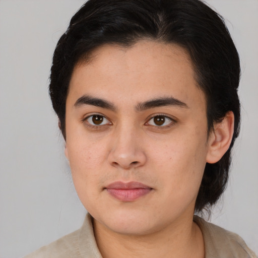 Joyful white young-adult male with medium  brown hair and brown eyes