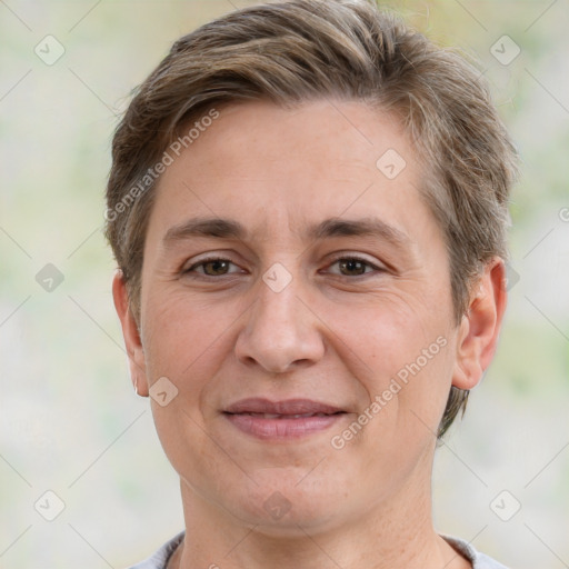 Joyful white adult female with short  brown hair and grey eyes