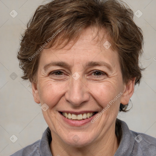 Joyful white adult male with medium  brown hair and brown eyes