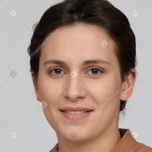 Joyful white adult female with short  brown hair and brown eyes