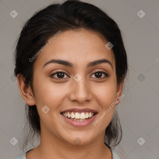 Joyful latino young-adult female with medium  brown hair and brown eyes