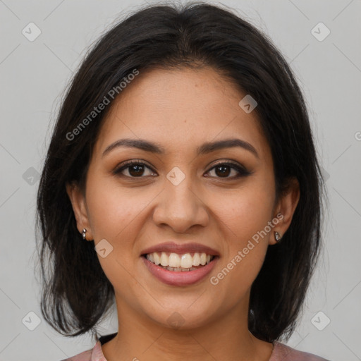 Joyful latino young-adult female with medium  brown hair and brown eyes