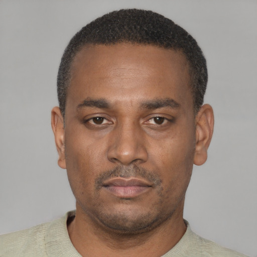 Neutral black young-adult male with short  black hair and brown eyes