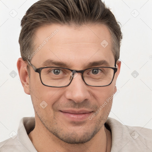 Joyful white adult male with short  brown hair and grey eyes