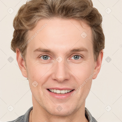 Joyful white adult male with short  brown hair and grey eyes