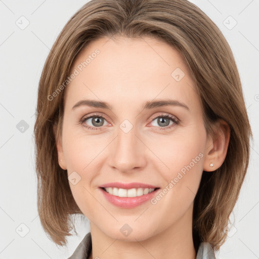 Joyful white young-adult female with medium  brown hair and green eyes