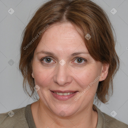 Joyful white adult female with medium  brown hair and brown eyes