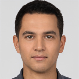 Neutral white young-adult male with short  black hair and brown eyes