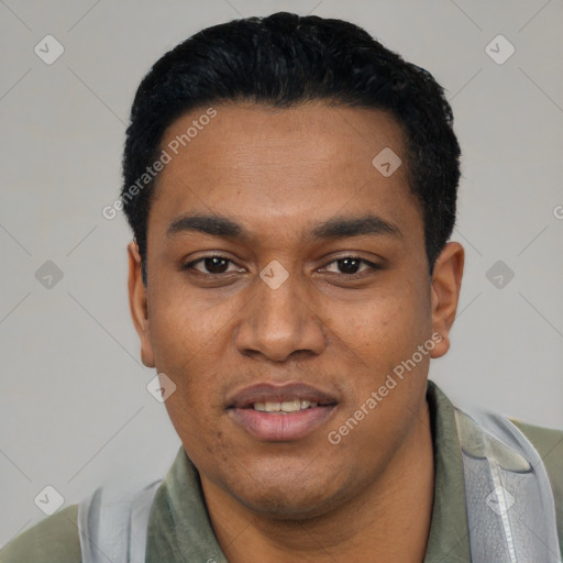 Joyful latino young-adult male with short  black hair and brown eyes