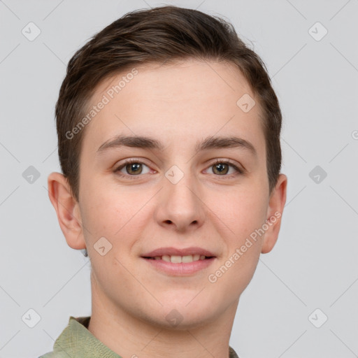 Joyful white young-adult male with short  brown hair and grey eyes