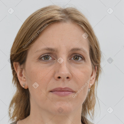 Joyful white adult female with medium  brown hair and grey eyes