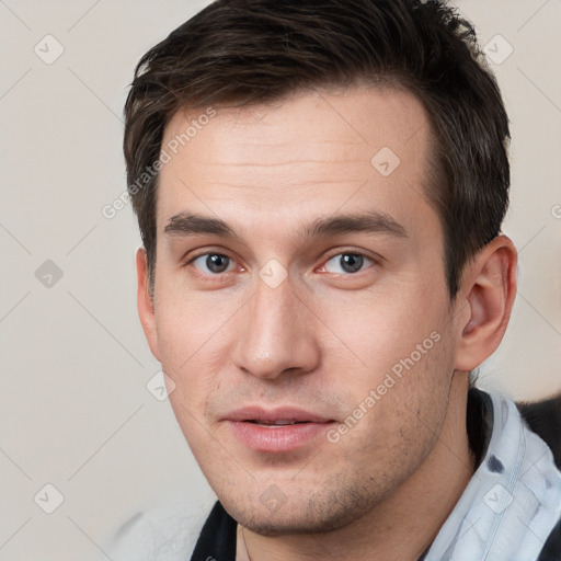 Neutral white young-adult male with short  brown hair and brown eyes