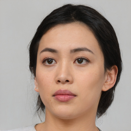 Neutral asian young-adult female with medium  black hair and brown eyes