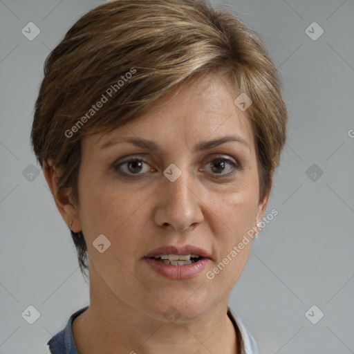 Joyful white adult female with short  brown hair and grey eyes