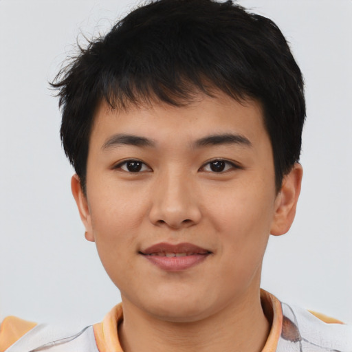 Joyful asian young-adult male with short  black hair and brown eyes