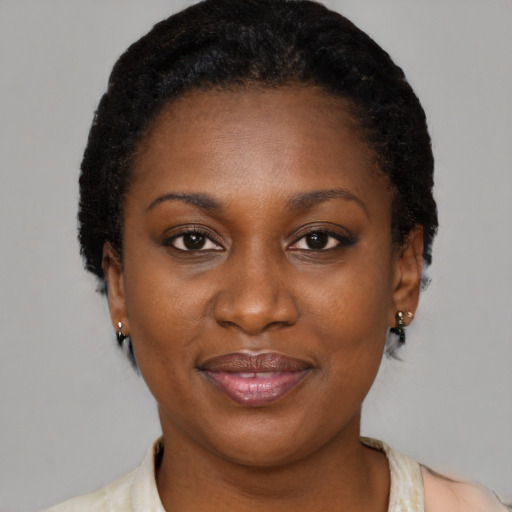 Joyful black young-adult female with short  brown hair and brown eyes