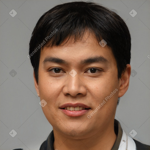 Joyful asian young-adult male with short  black hair and brown eyes