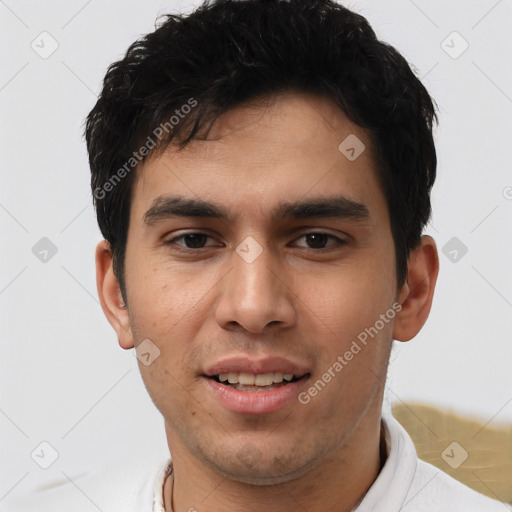 Joyful white young-adult male with short  black hair and brown eyes