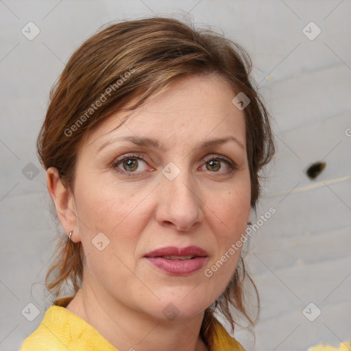 Joyful white adult female with medium  brown hair and grey eyes