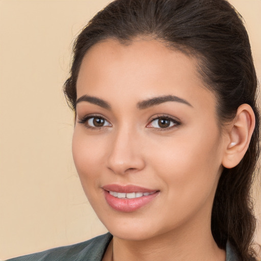 Joyful white young-adult female with long  brown hair and brown eyes