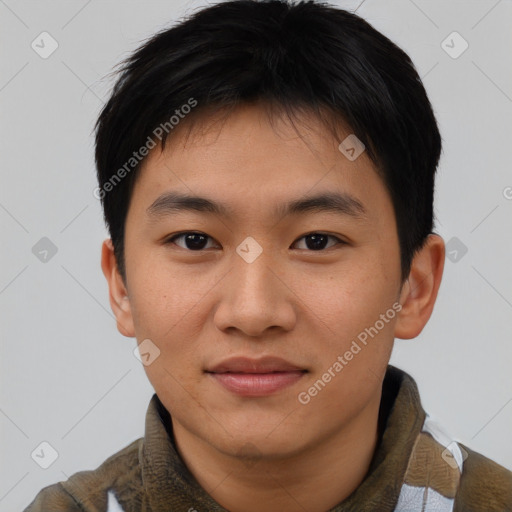 Joyful asian young-adult male with short  brown hair and brown eyes