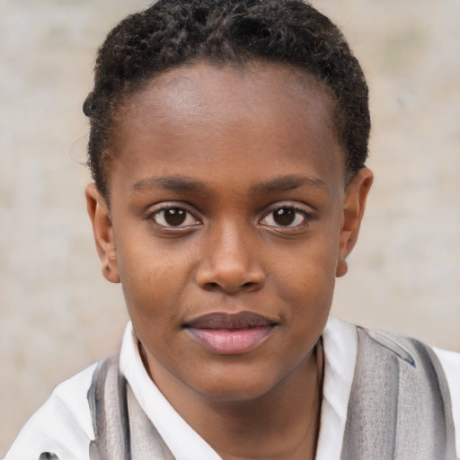 Joyful black child female with short  brown hair and brown eyes