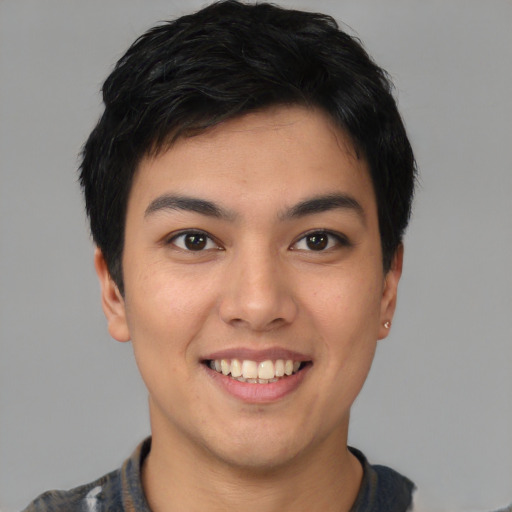 Joyful asian young-adult male with short  black hair and brown eyes