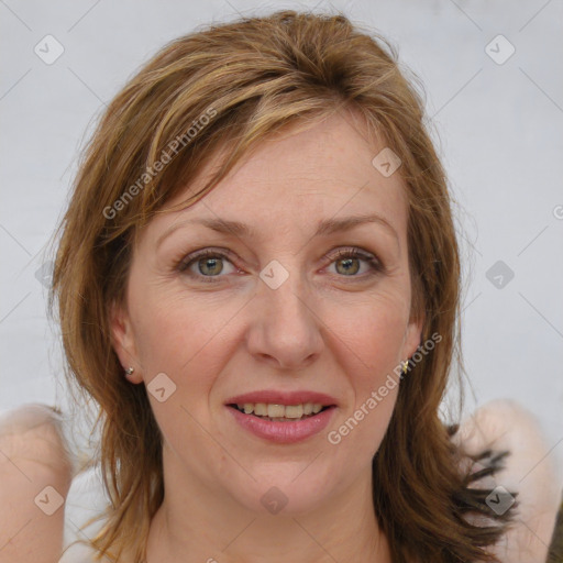 Joyful white adult female with medium  brown hair and green eyes