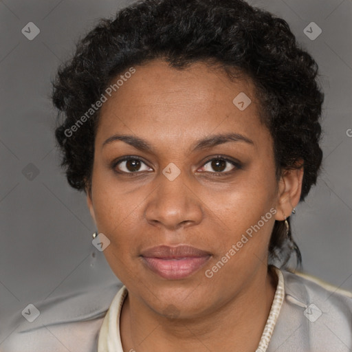 Joyful black adult female with short  brown hair and brown eyes