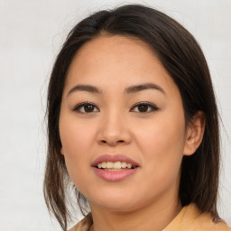 Joyful asian young-adult female with medium  brown hair and brown eyes