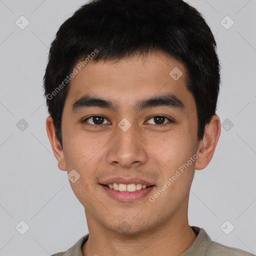 Joyful asian young-adult male with short  brown hair and brown eyes