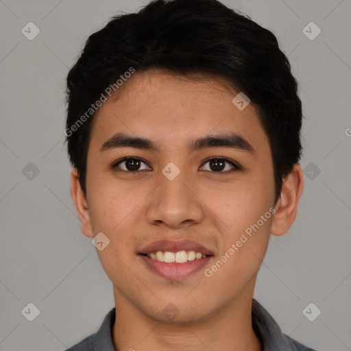 Joyful asian young-adult male with short  black hair and brown eyes