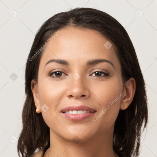 Joyful latino young-adult female with medium  brown hair and brown eyes