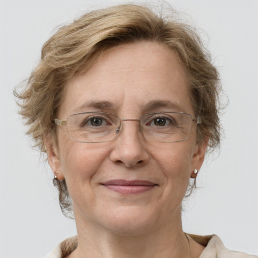 Joyful white middle-aged female with medium  brown hair and grey eyes