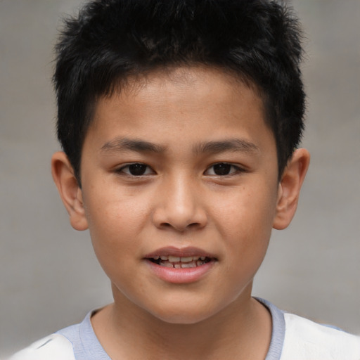 Joyful white child male with short  brown hair and brown eyes