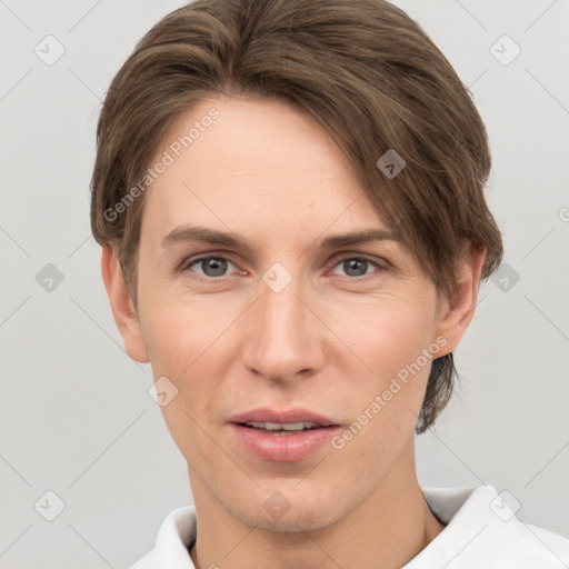 Joyful white young-adult female with short  brown hair and grey eyes