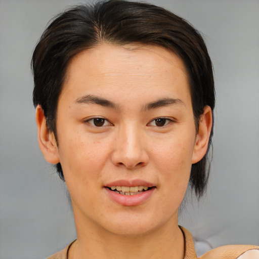 Joyful asian young-adult female with medium  brown hair and brown eyes