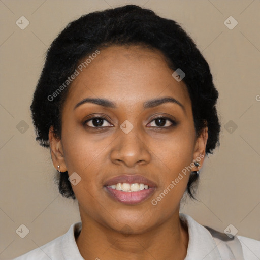 Joyful black young-adult female with short  black hair and brown eyes
