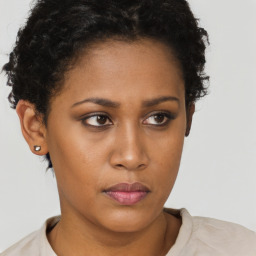 Neutral black young-adult female with short  brown hair and brown eyes