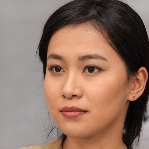 Neutral asian young-adult female with medium  black hair and brown eyes