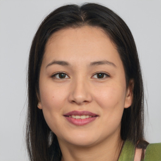 Joyful white young-adult female with long  brown hair and brown eyes